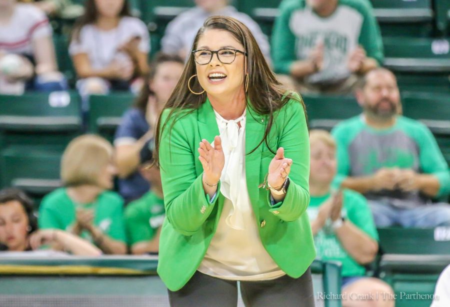 Marshall volleyball coach Ari Agnus celebrates a job well done by her team. 