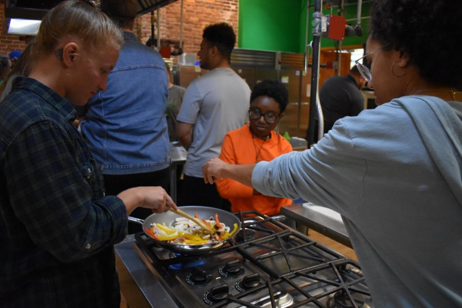 Marshall students learn a  healthy recipe and cooking tips and tricks during a trip to Huntington’s Kitchen for a Shop Green… Eat Clean event Oct. 9.