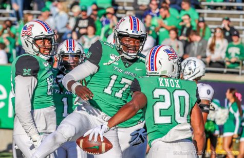Marshall football player Isaiah Green is all smiles with teammate Brenden Knox in the game against Old Dominion.