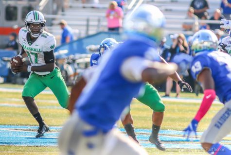 Herd quarterback Isaiah Green looks for an open receiver during Herd football game vs Middle Tennessee State University Oct. 5.