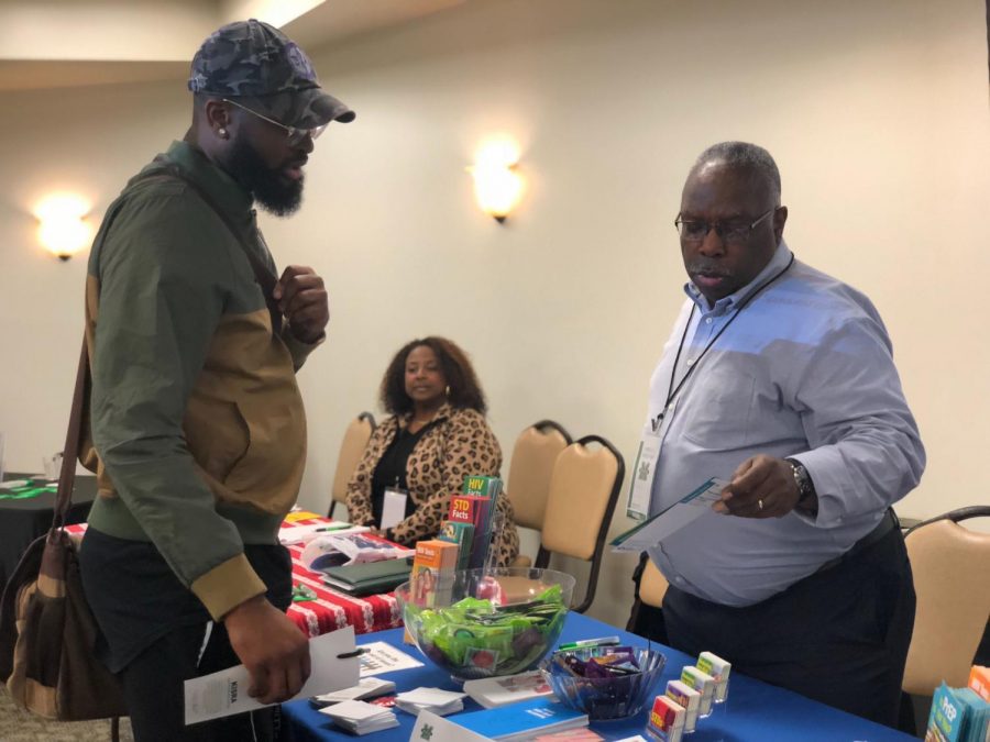 Marshall public health student Fortune Ezemobi interacts with Nils Haynes of the West Virginia Bureau for Public Health during the inaugural Minority Health Fair at the Memorial Student Center Oct. 17.