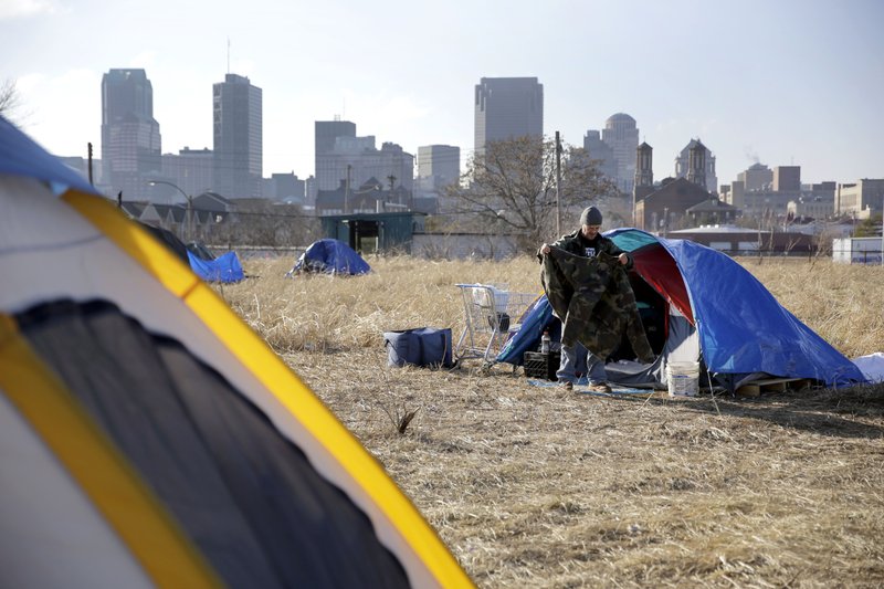 In+this+Tuesday%2C+Jan.+27%2C+2015+file+photo%2C+Terry+cleans+out+his+tent+at+a+large+homeless+encampment%2C+near+downtown+St.+Louis.