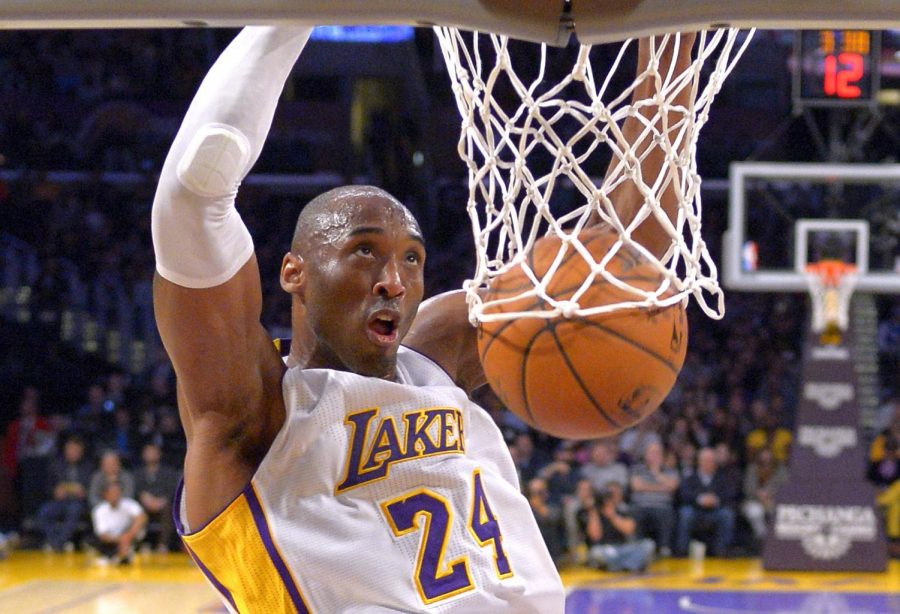 In this Jan. 4, 2015 file photo Los Angeles Lakers guard Kobe Bryant dunks during the first half of an NBA basketball game against the Indiana Pacers in Los Angeles. Bryant, a five-time NBA champion and a two-time Olympic gold medalist, died in a helicopter crash in California on Sunday, Jan. 26, 2020. He was 41.