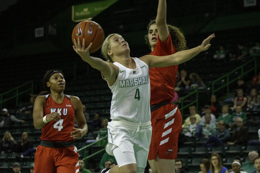 Freshman+guard+Savannah+Wheeler+drives+to+the+basket+against+WKU%E2%80%99s+Raneem+Elgedawy.