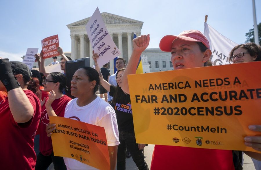 In this June 2019 photo, demonstrators gather at the Supreme Court on Capitol Hill as justices finish the term with key decisions on gerrymandering and a census case involving the Trump administration’s attempt to ask about citizenship status in the 2020 census.