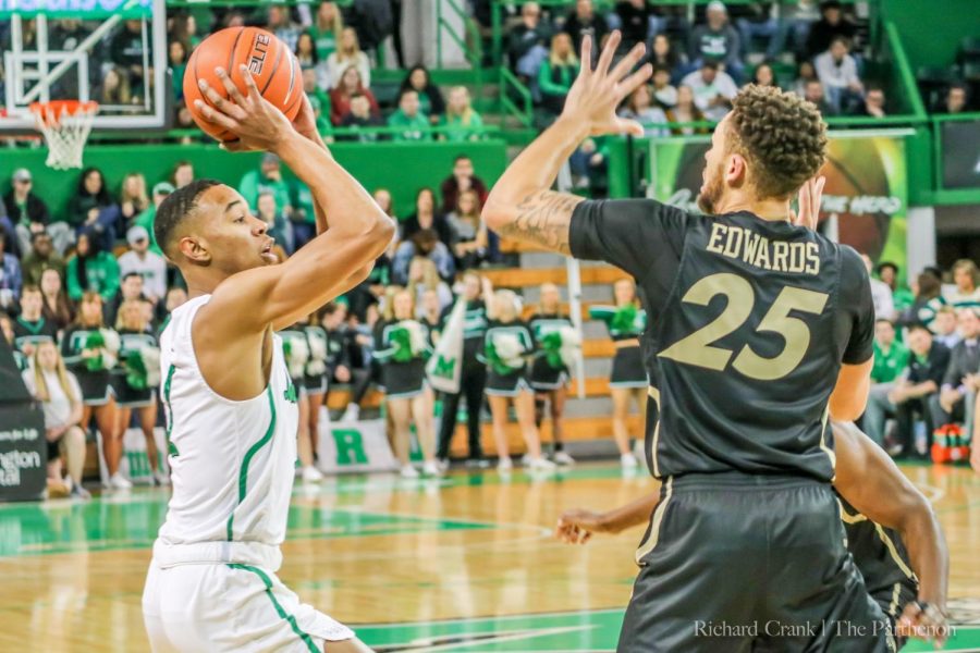 Taevion Kinsey lined up his shot during a home game at the Cam Henderson Center.