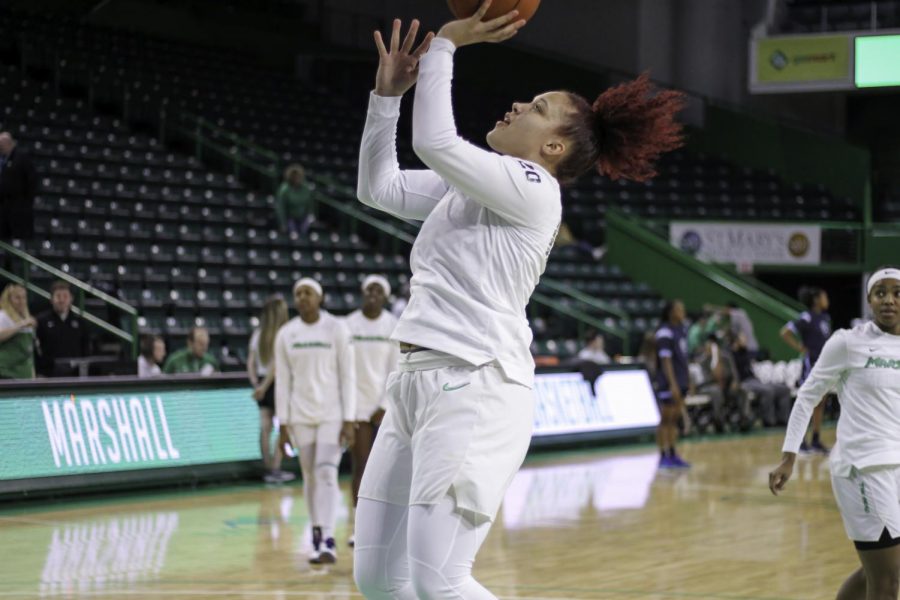 Junior forward Taylor Pearson attempted a layup during game day warmups.