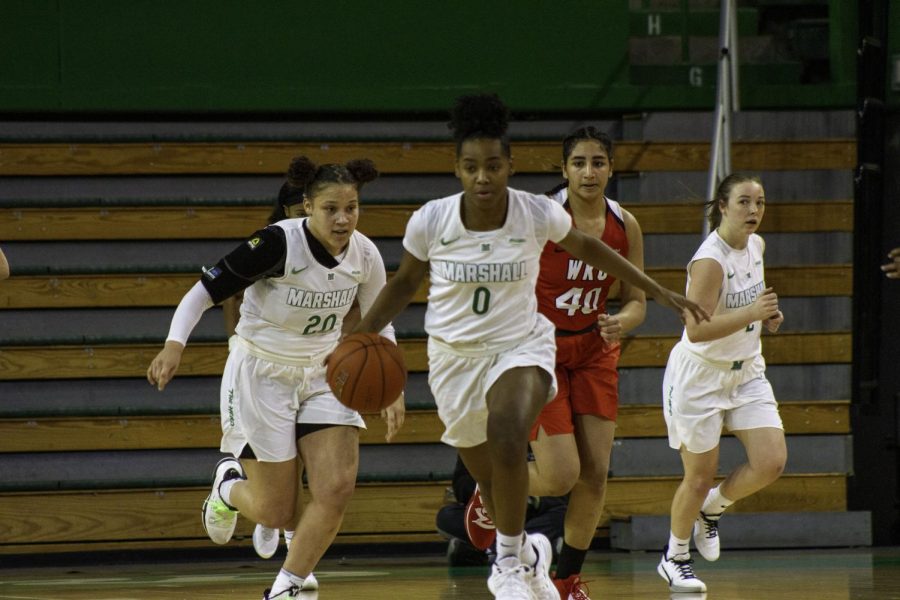 Sophomore guard Kia Sivils and junior forward Taylor Pearson pushed the ball up the court against WKU.