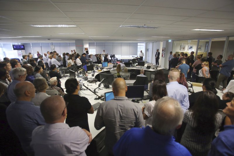 Staff at the Australian Associated Press head office gather for an announcement in Sydney, March 3, 2020.