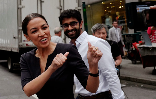 Alexandria Ocasio-Cortez, the winner of a Democratic Congressional primary in New York, greets a passerby in New York, Wednesday, June 27, 2018, the morning after she upset U.S. Rep. Joe Crowley in Tuesdays primary election. (AP Photo/Mark Lennihan)