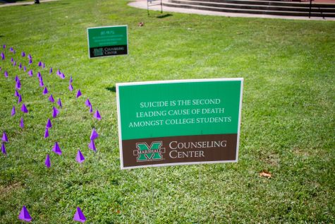 Multiple signs are placed around Marshall's campus.