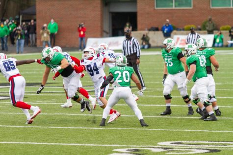 The Marshall University football team's offense attempts to make an offensive play agains the FAU Owls during its Homecoming Game on Saturday, Oct. 24.