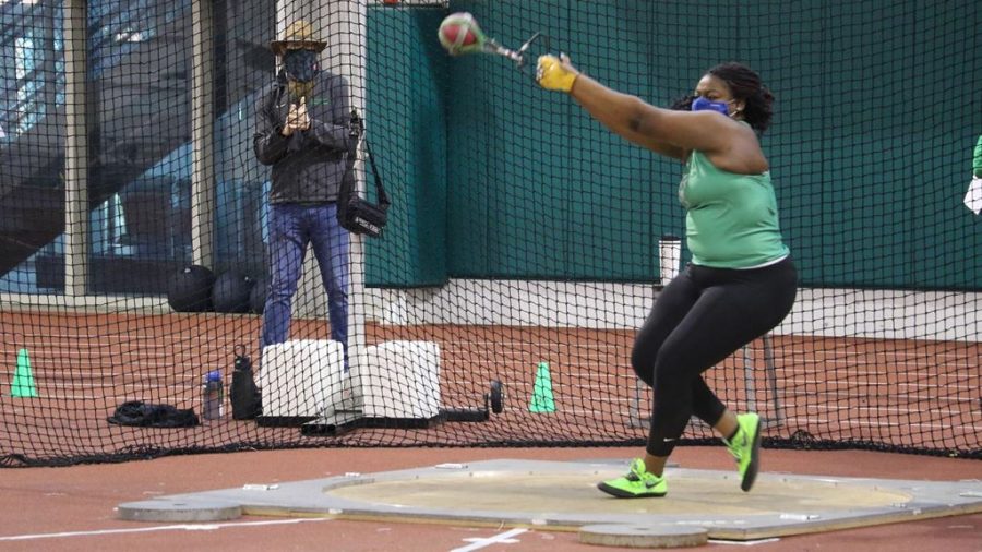 MaryAnn Adebayo tosses a weight during the Marshall classic on Saturday, Feb. 6.  