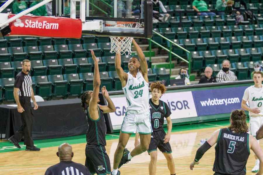 Junior guard Taevion Kinsey goes up for a dunk against Ohio University on Dec. 13.