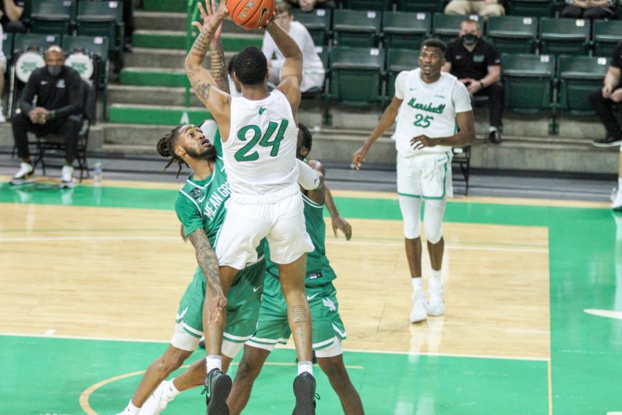Junior+guard+Taevion+Kinsey+pulls+up+for+a+jumper+against+North+Texas+Saturday%2C+Feb.+27.+He+scored+18+points%2C+helping+lead+a+Jarrod+West-less+Marshall+basketball+team+to+a+73-72+victory.+