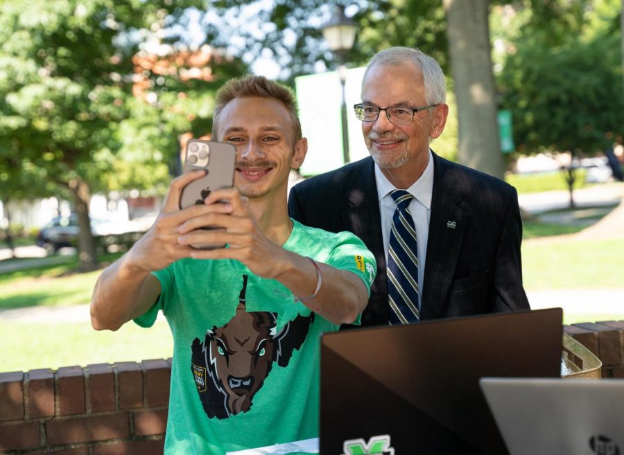 President+Gilbert+poses+for+a+selfie+while+on+campus