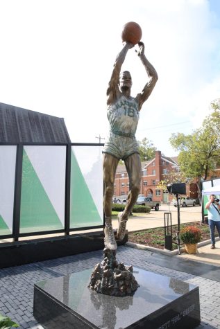 The statue, created by Huntington Native and Marshall graduate Frederick Hightower Sr., is a nearly eight-foot-tall bronze figure of Greer in his number 16 Marshall jersey. | Richard Crank