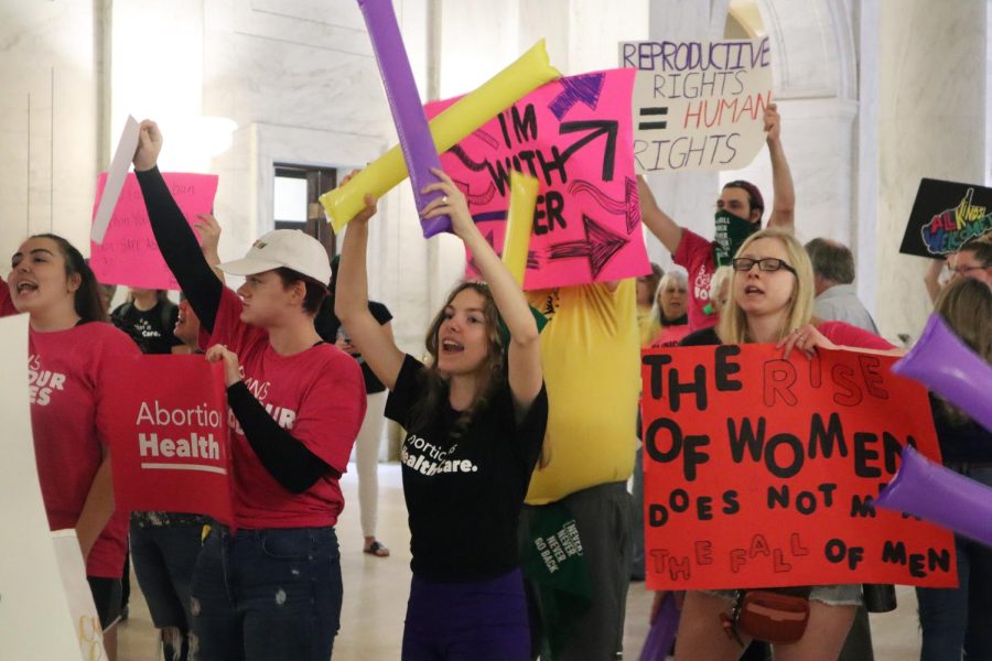 Protestors rally outside the Senate chamber at the West Virginia state Capitol in Charleston, W.Va., as lawmakers debated a sweeping bill to ban abortion in the state with few exceptions on Tuesday, Sept. 13.