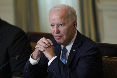 President Joe Biden waits for members of the press to leave after speaking at a meeting of the White House Competition Council in the State Dining Room of the White House in Washington, Monday, Sept. 26, 2022.