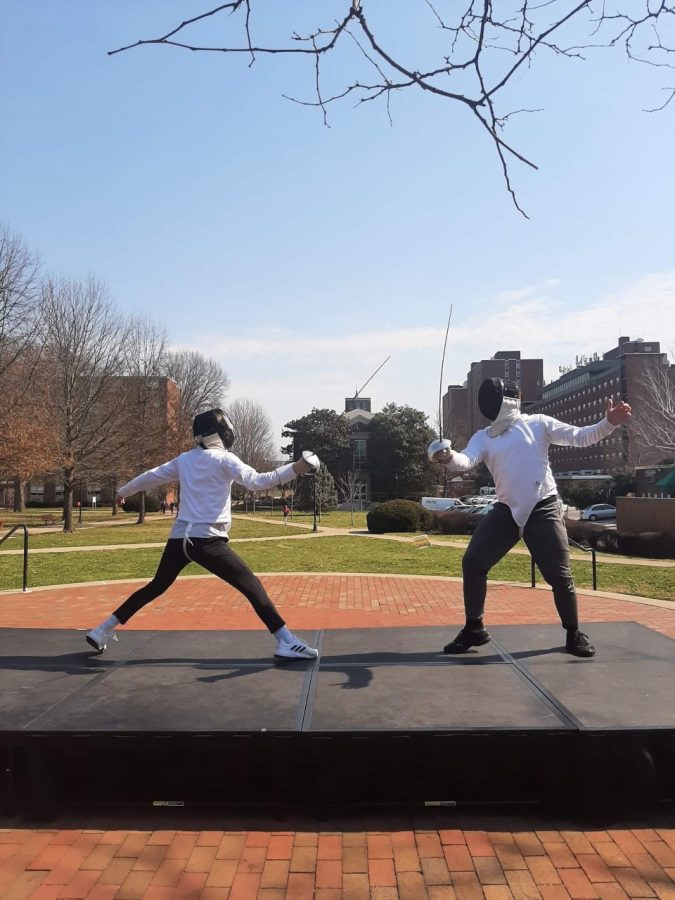 Members of the Fencing Club Practice outside the Memorial Student Center
