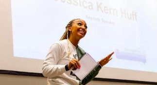 Jessica Huff speaks at a community event.