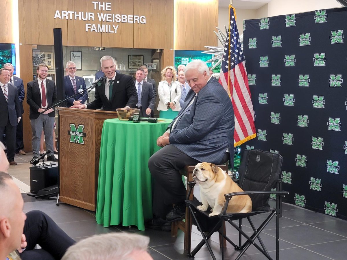 Smith, Gov. Justice and Baby Dog at the signing of Bill 117