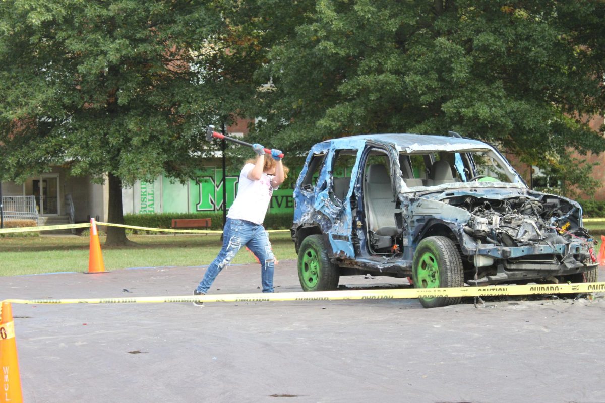 Students paid $1 to bash a car colored to represent ODU in preparation for Homecoming 2023.