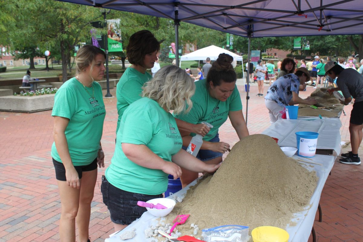 Members from the Marshall LASIK Center making their sand sculpture.