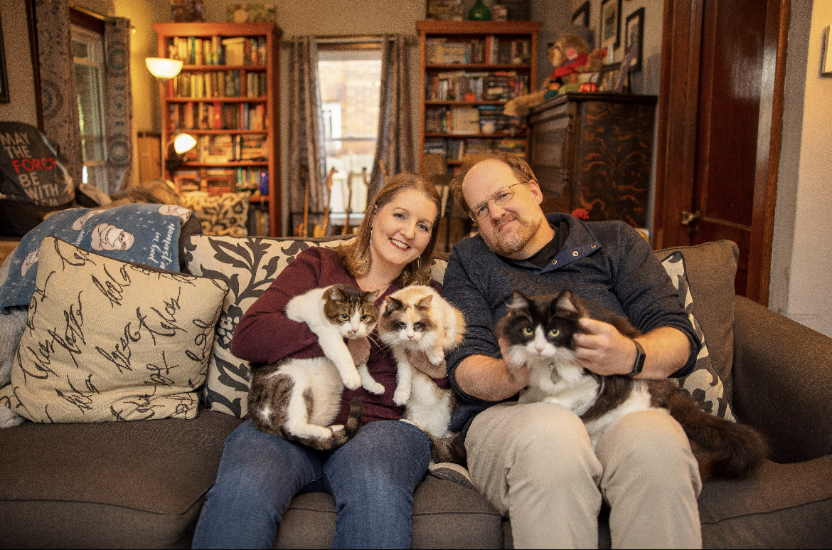 Cody Lumpkin and Jill Treftz pose with their assortment of feline companions.
Courtesy of Jill Treftz