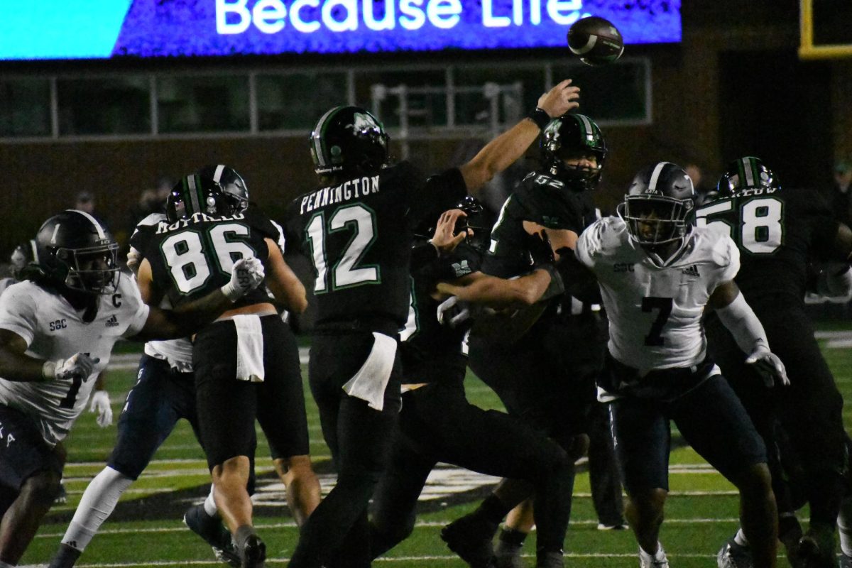 Cole Pennington releases a pass during a game last season.