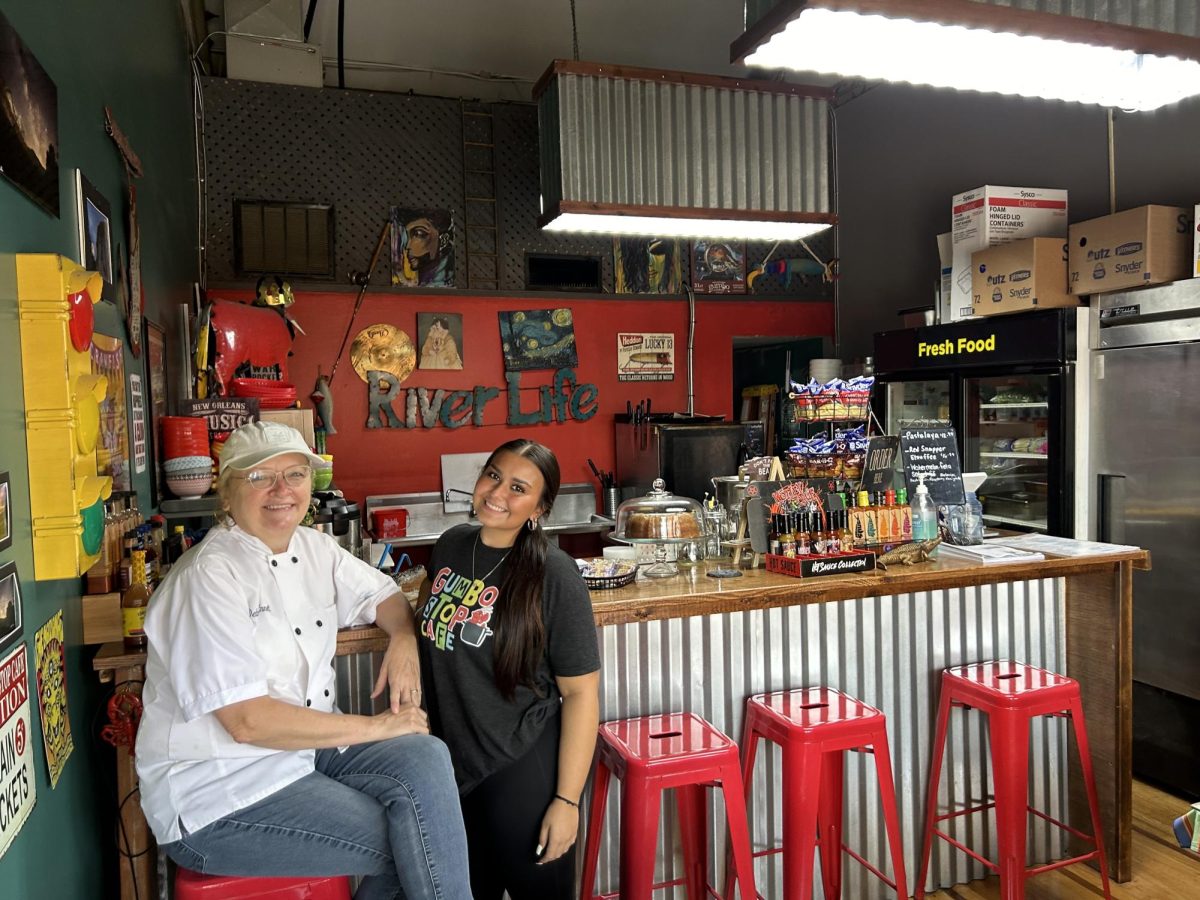 Debbie Annett and Bea Meade in front of the Gumbo Stop Cafe counter. 