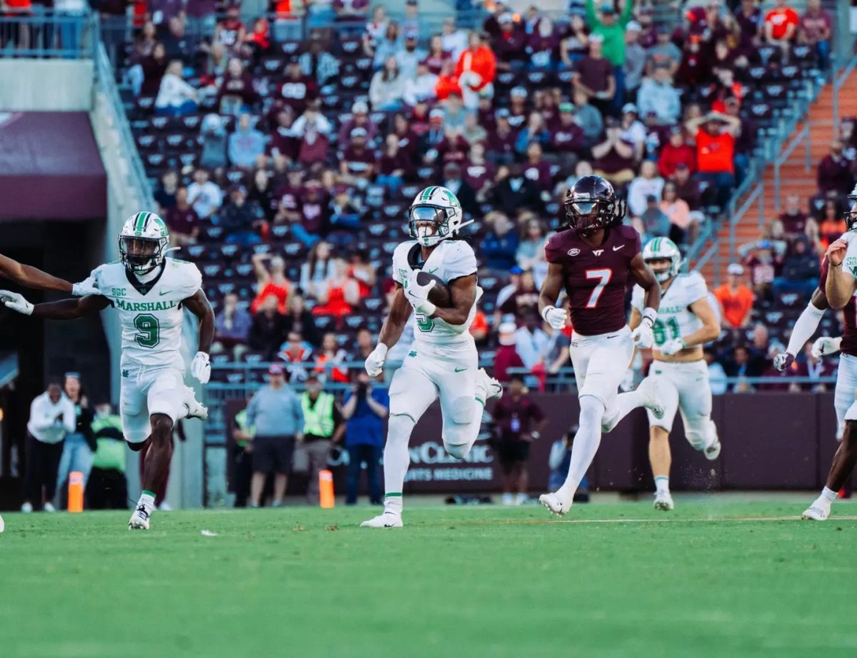 A.J. Turner runs the ball during the Virginia Tech game Saturday, Sept. 7. 
