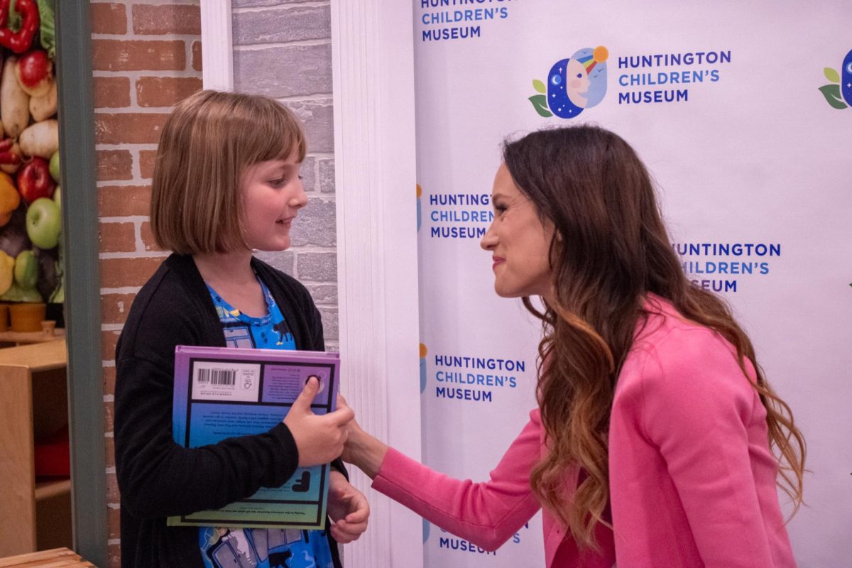 Calandrelli meets with local child, Marjorie Damron.