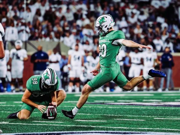 Verhoff prepares to kick with Alec Clark holding.