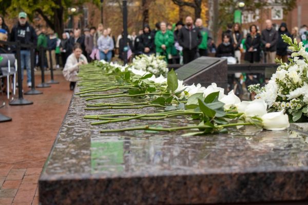 Representing the 75, roses were rested on the fountain during the ceremony.