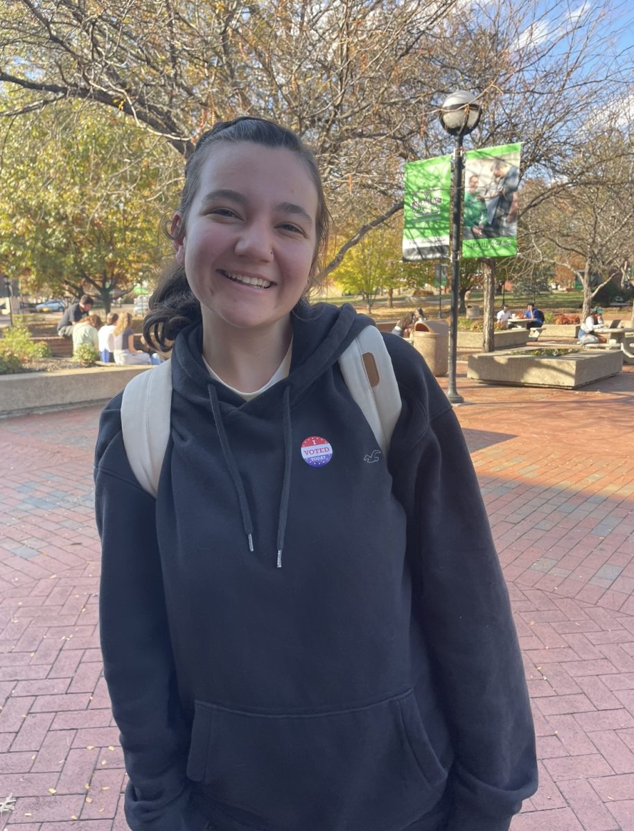 A Marshall University student poses with their "I Voted Today" sticker.