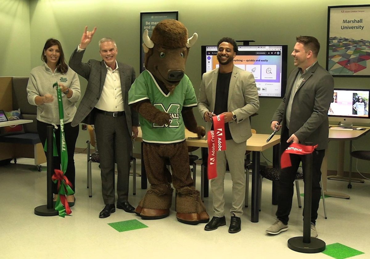 University and Adobe officials cut the ribbon at the ceremony.