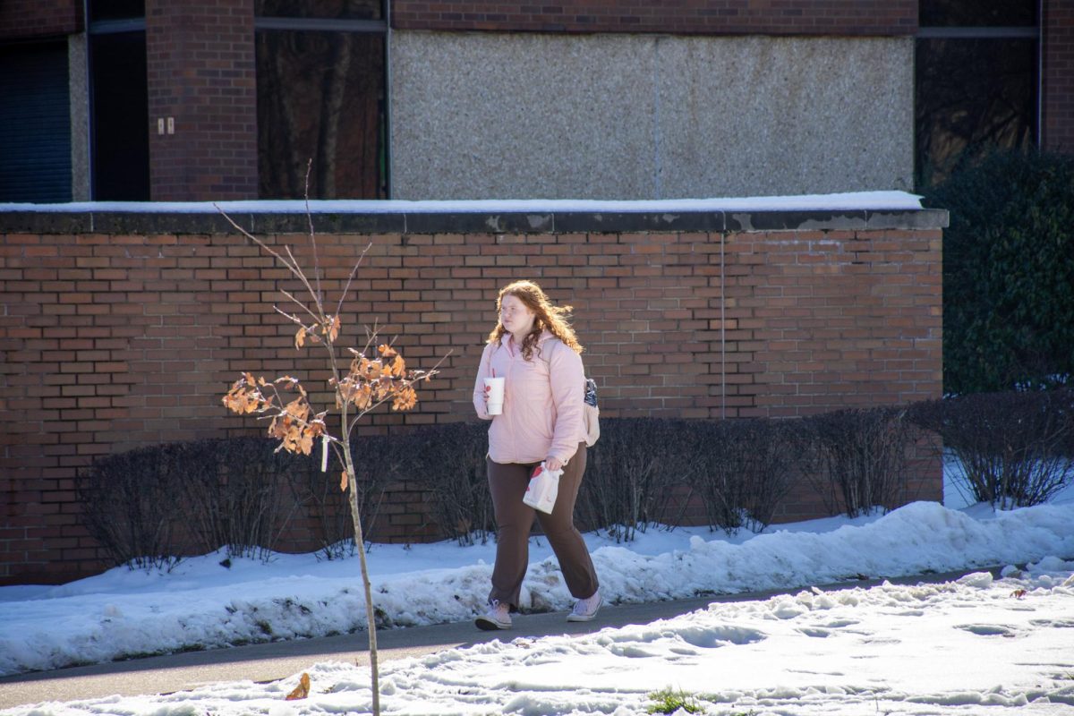 Student walking on Marshall's campus