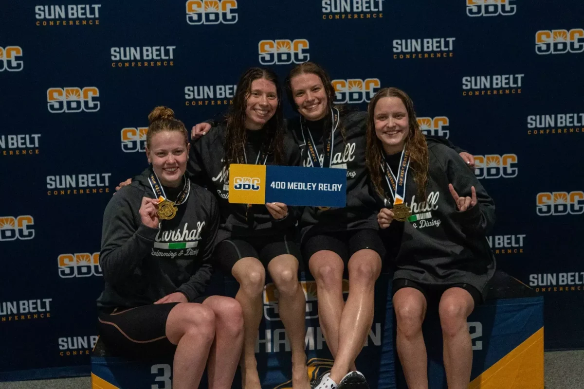 Luniushina, Banton, Hart and West celebrate Marshall’s first 400 medley relay title. 