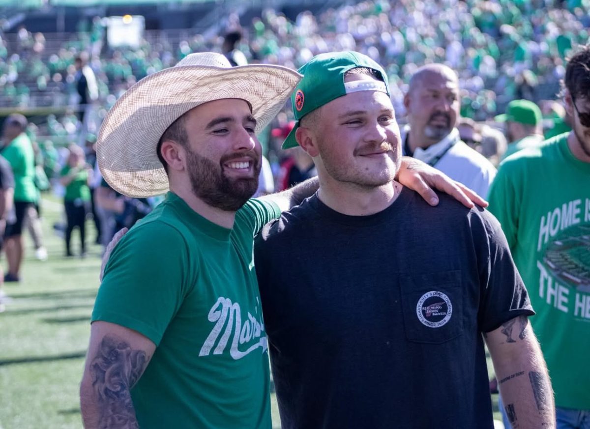 Zach Bryan and his tour manager Jay-Michael Cisco at the Marshall Football game on Oct. 5, 2024. (The Parthenon/Wade Sullivan)