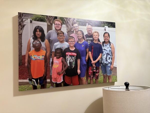 A photo of the Cox family taken on the last Father’s Day Sunday before Maribeth was killed now hangs in their home as a cherished memory. 