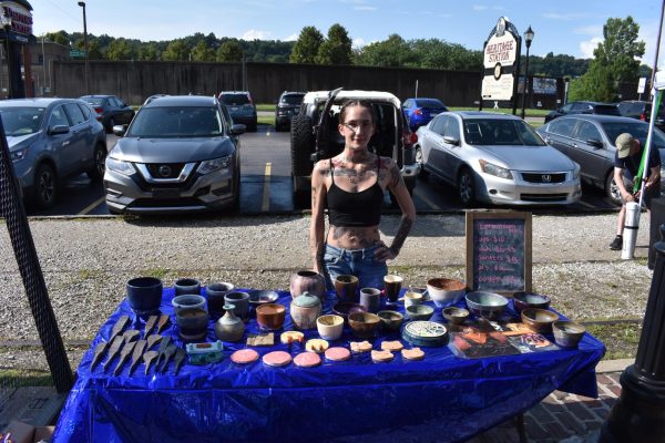 Marshall graduate Samantha Taylor selling her pottery pieces at the Downtown Art Walk
