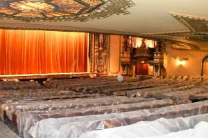 Tarps laid over the theater chairs during renovations