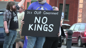 Protesters gather near Heritage Station as No Kings national protest returns to Huntington, opposing the Trump administration.